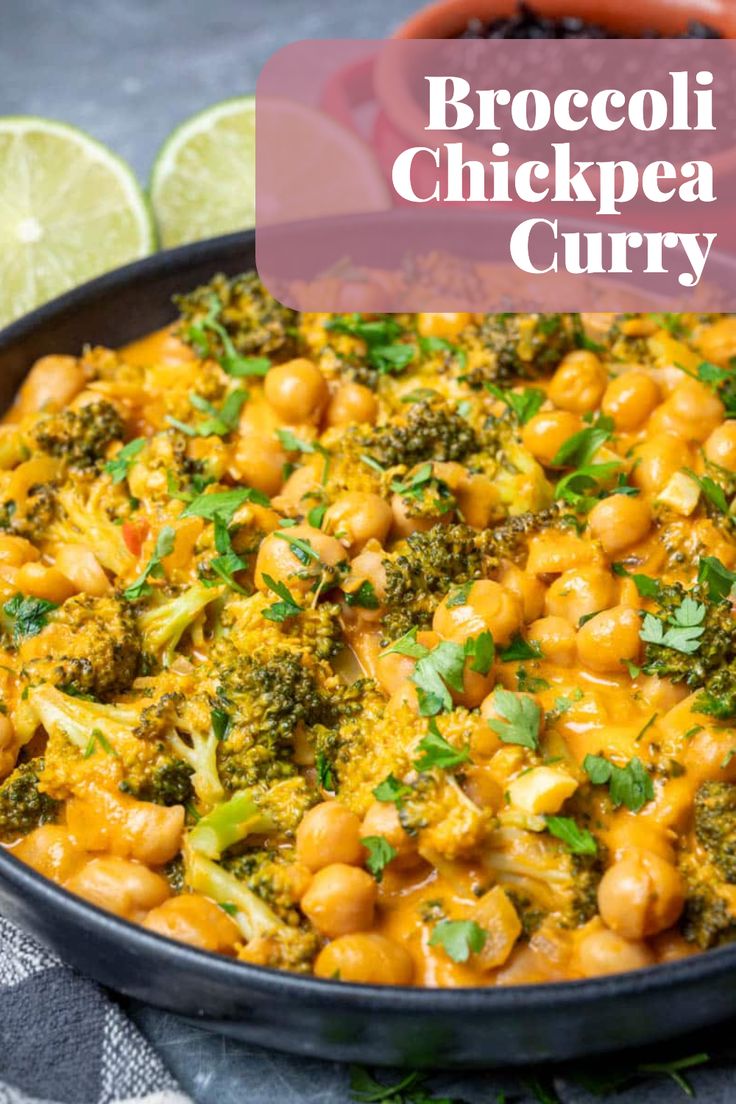 broccoli and chickpea curry in a skillet with lime wedges