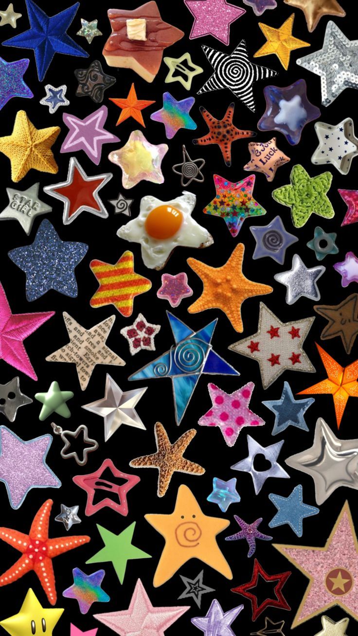 many different colored stars on a black background