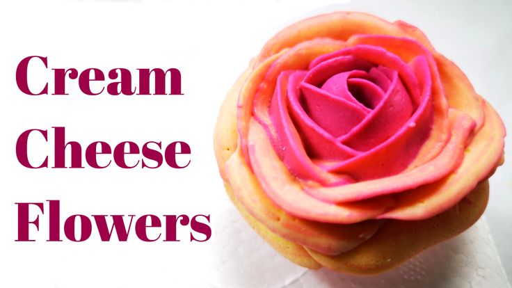 a cupcake with pink frosting on top and the words cream cheese flowers above it