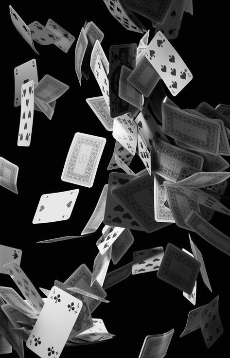 playing cards falling from the sky into the air