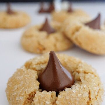 some cookies with chocolate on top are sitting on a table