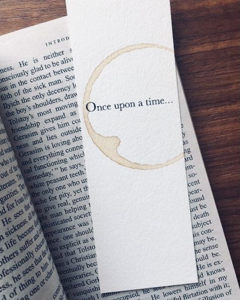 an open book with the words once upon a time on it