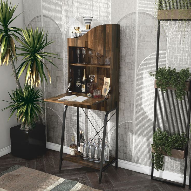 a wooden desk sitting next to a potted plant