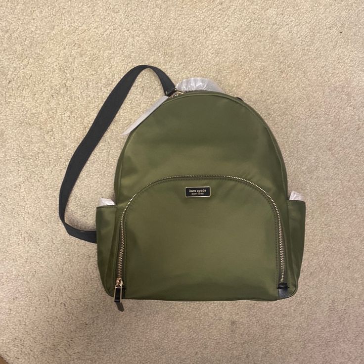 Never Been Used, New With Tags. Color: Sapling Kate Spade Casual Standard Backpack, Kate Spade Casual Backpack, Trendy Kate Spade Standard Backpack, Green Backpack With Detachable Strap For Travel, Trendy Kate Spade Backpack, Kate Spade Backpack With Zipper Closure, Kate Spade Casual School Backpack, Casual Kate Spade School Backpack, Kate Spade Travel Shoulder Bag