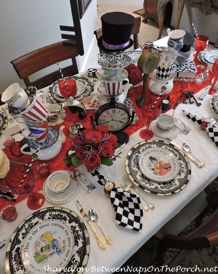 the table is set with many plates and silverware