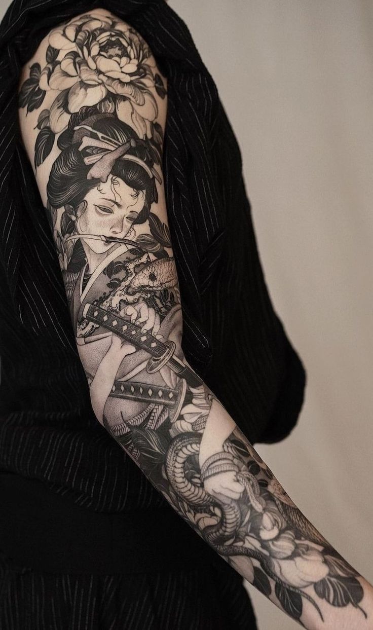 a woman with a tattoo on her arm