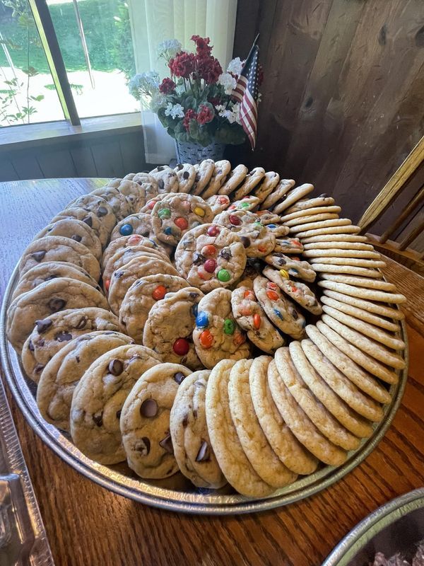 a large platter filled with cookies and candy