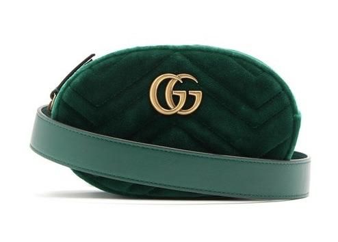 For SS18, Gucci reimagines its GG Marmont style in emerald-green quilted velvet for this belt bag. It's crafted in Italy, and features an antiqued gold-tone metal front plaque with the top-zip opening to a red satin lining. It's designed to be worn high on the waist, and can also be slung across the body and carried as a clutch, thanks to the detachable and adjustable buckle-fastening strap. Position yours over the house's separates for an on-brand look. Size 95cm Formal Gucci Bags With Logo Plaque, Luxury Green Quilted Bag, Gucci Green Bags With Gold-tone Hardware, Green Gucci Bag With Gold-tone Hardware, Luxury Formal Bag With Belt Detail, Luxury Belted Bag For Formal Occasions, Gucci Luxury Leather Belt Bag, Rectangular Leather Gucci Belt Bag, Chic Green Gucci Bag