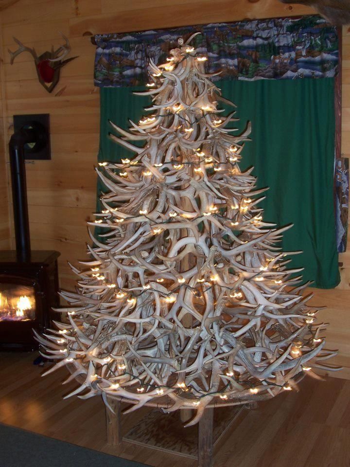 a christmas tree made out of antlers and lights