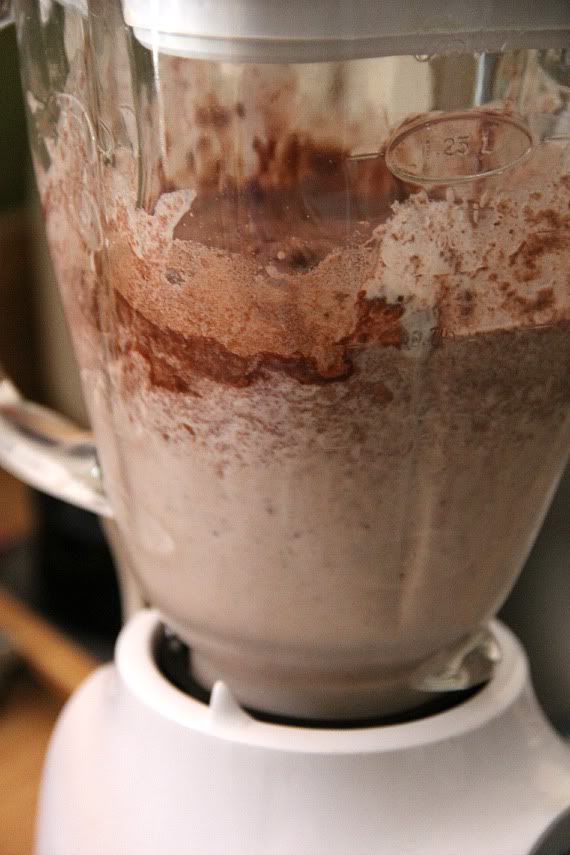 a blender filled with food on top of a counter