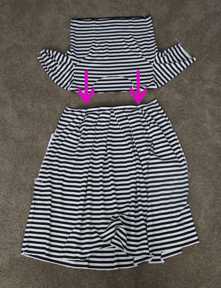 two pieces of clothing are shown with pink arrows pointing to the left and right sides