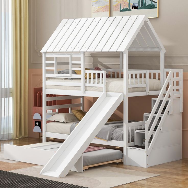 there is a bunk bed with a slide in the bottom and stairs to the top