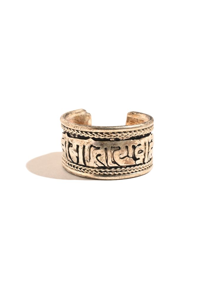 This adjustable ring is hand crafted by local artists of Katmandu Nepal. It features the well known and beloved Tibetan holy mantra Om Mani Padme Hum artfully carved around the band, with a delicate ropelike design around both sides. The ring can be gently pressed together to adjust to whichever finger on which you choose to wear it. Wear it for protection in all directions and to bring love and spiritual harmony into your journey. Made of sterling silver, it is attractive and adjustable. Measur Mantra Band Ring, Aum Mani Padme Hum, Om Mane Padme Hum, Adjustable Brass Spiritual Ring, Katmandu Nepal, Nepal Jewelry, Tibetan Ring, Drum Accessories, Om Mani Padme Hum