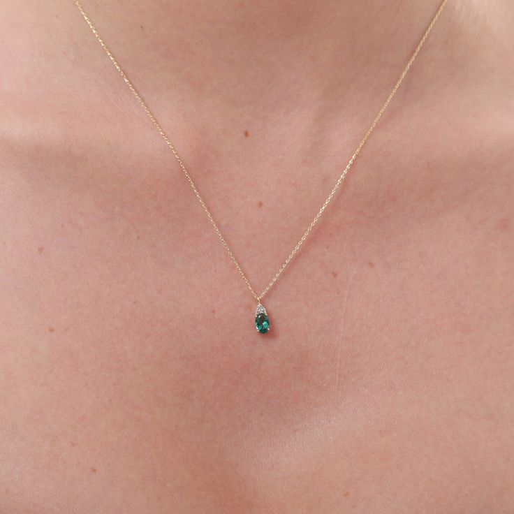 14K Gold Oval Cut Emerald Necklace, Green Gemstone Necklace, May Birthstone Emeralds are often associated with the color green, which represents growth, renewal, and vitality. Wearing an emerald necklace can symbolize personal growth, new beginnings, and a fresh start in life.  Some believe that emeralds have a spiritual significance, representing balance, harmony, and connection with nature. Wearing an emerald necklace can symbolize a person's spiritual journey and quest for inner harmony. Emer Minimalist Green Emerald Gemstone Necklace, Green Minimalist Gemstone Birthstone Necklace, Everyday Green Teardrop Pendant Jewelry, Minimalist Green Teardrop Pendant Jewelry, Dainty Green Gemstone Birthstone Necklace, Green Birthstone Teardrop Pendant Necklace, Green Teardrop Pendant Necklace With Birthstone, Green Teardrop Pendant Birthstone Necklace, Minimalist Green Pendant Birthstone Necklace