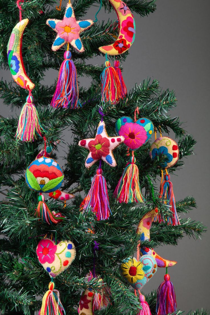 a christmas tree with ornaments hanging from it's branches