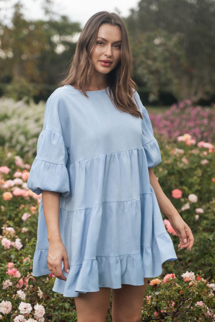 Introducing our Light Blue Puff Sleeve Ruffled Mini Dress, a delightful blend of charm and sophistication. Crafted from soft and airy fabric, this dress features romantic puff sleeves that add a touch of drama, while the ruffled detailing lends a playful and feminine flair. The light blue hue evokes a sense of freshness and tranquility, perfect for brightening up any occasion. Product code: CAA05A4C218SS Features:  Woven Round neckline Short puff sleeves Ruffled hem Mini Wash Method: Regular Was Spring Flowy Puff Sleeve Dress With Lantern Sleeves, Flowy Puff Sleeve Dress With Lantern Sleeves For Spring, Spring Dress With Ruffle Hem And Balloon Sleeves, Blue Puff Sleeve Dress For Garden Party, Spring Dress With Balloon Sleeves And Ruffle Hem, Spring Balloon Sleeve Dress With Ruffle Hem, Spring Puff Sleeve Dress With Pleated Billowy Sleeves, Spring Billowy Puff Sleeve Dress With Pleated Sleeves, Billowy Puff Sleeve Dress With Ruffles For Spring