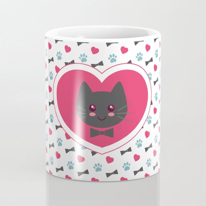 a coffee mug with a cat's face in a heart surrounded by paw prints