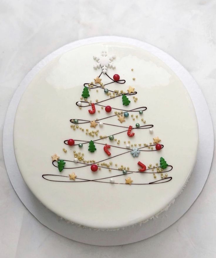 a white plate with a decorated christmas tree on it