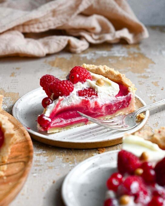 a slice of raspberry pie on a plate