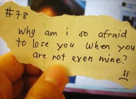 someone holding up a piece of paper that says, why am i do afraid to love you when you are not even mine?