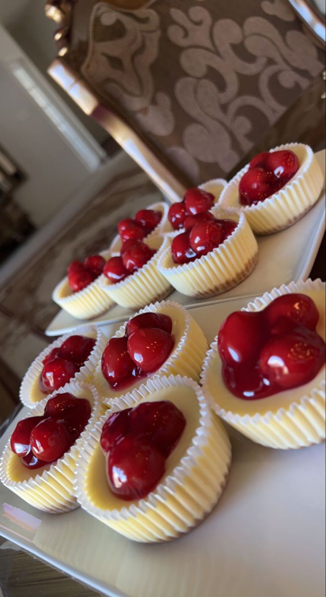 some heart shaped desserts are sitting on a table