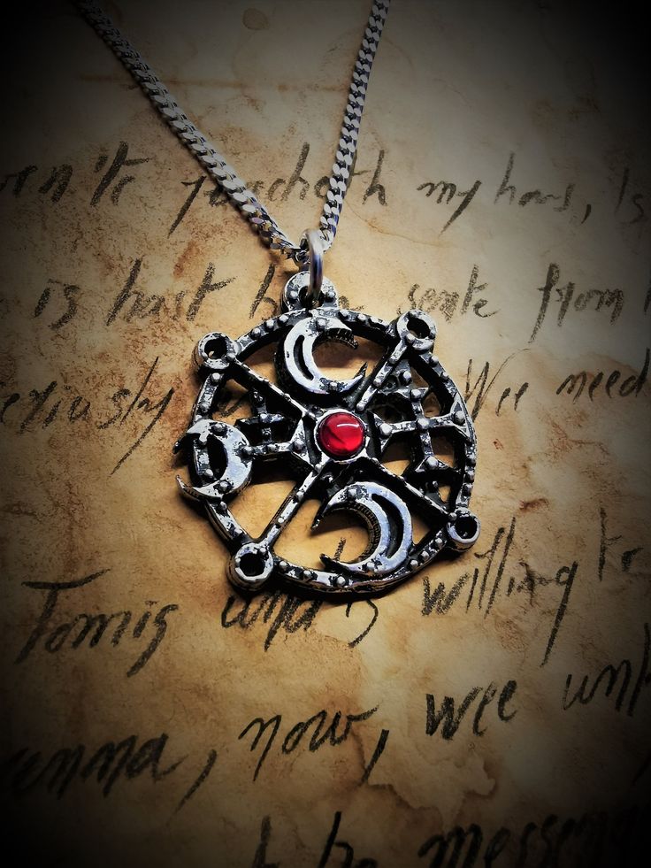 This Sigil of Decarabia necklace is an handmade pewter sculpture with a gem of your choice (my favorite is the red abalone, if you are looking for a very nice bloody red) This seal of Decarabia is one of the 72 Sigils of Goetia from Ars Goetia's Demonology This Sigil of Goetia pendant is sold with a free 18'' stainless steel chain, if you would like to have a different length for the chain, you can write the desired length in the private note section when ordering :) This Seal of Decarabia is a Gothic Silver Pewter Jewelry, Gothic Pewter Jewelry In Silver, Handmade Gothic Antique Silver Jewelry, Handmade Antique Silver Gothic Jewelry, Handmade Gothic Jewelry In Antique Silver, Symbolic Engraved Metal Jewelry, Handmade Antique Silver Pewter Jewelry, Handmade Antique Silver Stainless Steel Jewelry, Symbolic Hand Cast Silver Jewelry