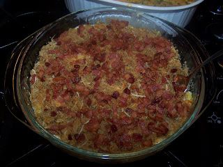 two casserole dishes sitting on top of an oven, one filled with food