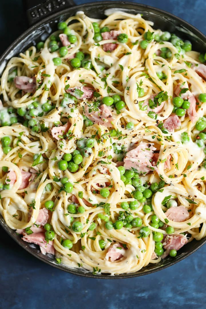 pasta with peas and ham in a skillet