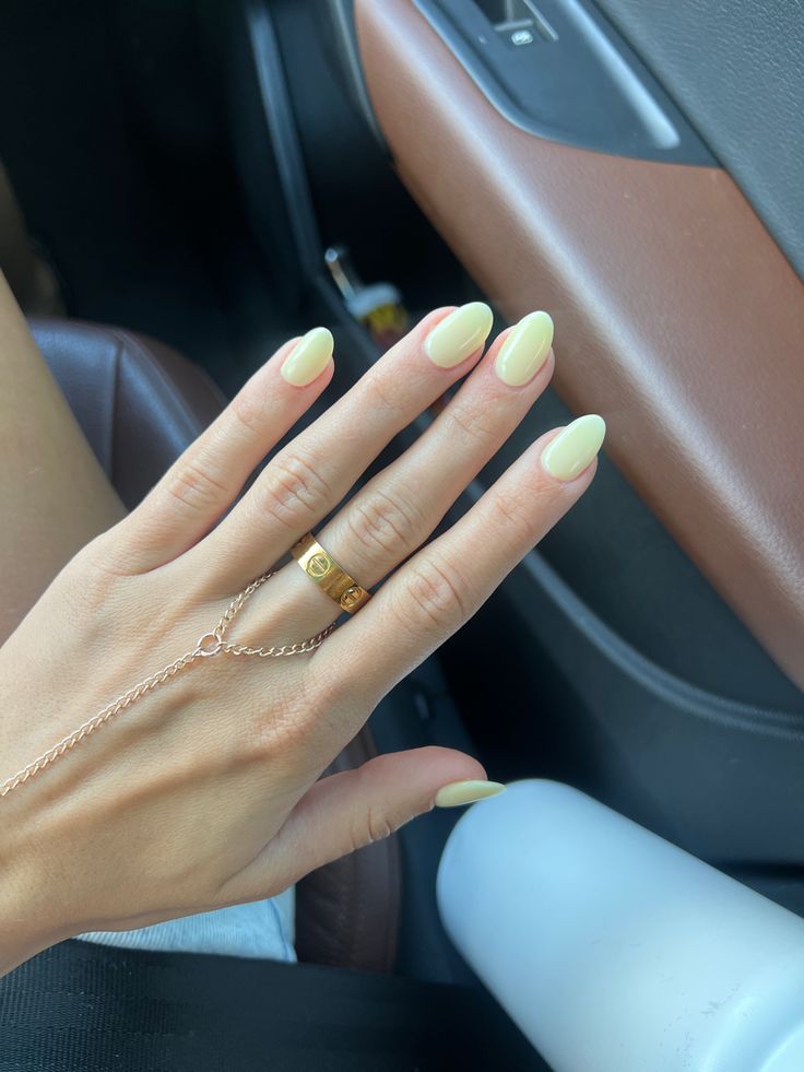 Light Yellow Manicure, Single Color Nails Simple, Back To School Nails Yellow, Dnd Pale Yellow Nails, Almond Nails Yellow Pastel, Pale Yellow Manicure, Light Yellow Acrylics, Yellow Almond Nails Summer, Yellow Almond Shaped Nails