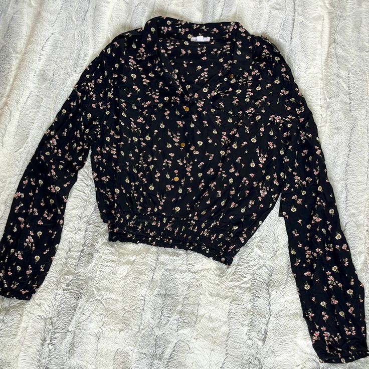 Women’s Button Up Crop Shirt -Black With Pink And White Flowers Size Large Two Faux Breast Pockets Shoulder Buttons Wide Elastic Waist New With Tags Black Collared Top With Floral Print, Black Collared Floral Print Top, Black Floral Print Collared Top, Black Collared Tops With Button Closure, Black Collared Top For Spring, Black Collared Top For Fall, Black Collared Blouse With Floral Print, Casual Black Collared Blouse, Black Button-up Casual Top