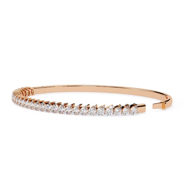 This 4 Carat Pear Shaped Diamond Bangle Bracelet Is in Rose Gold. the Graceful of The Bangle Embraces the Wrist, Creating a Harmonious Flow that Radiates Luxury. Each Diamond Is Carefully Selected for Its Clarity and Cut, Displaying Light with Every Movement. This Bracelet Is Not Just a Piece of Diamond Jewelry; It’s a Statement of Timeless Beauty, Perfect for Special Occasions or As Of Your Everyday Elegance. Small Diamond Engagement Rings, Diamond Bangle Bracelet, Black Engagement Ring, Black Wedding Rings, Everyday Elegance, Diamond Bangles Bracelet, Black Diamond Ring Engagement, Pear Cut Diamond, Black Diamond Ring