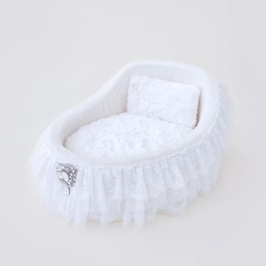 a white baby crib on a white background