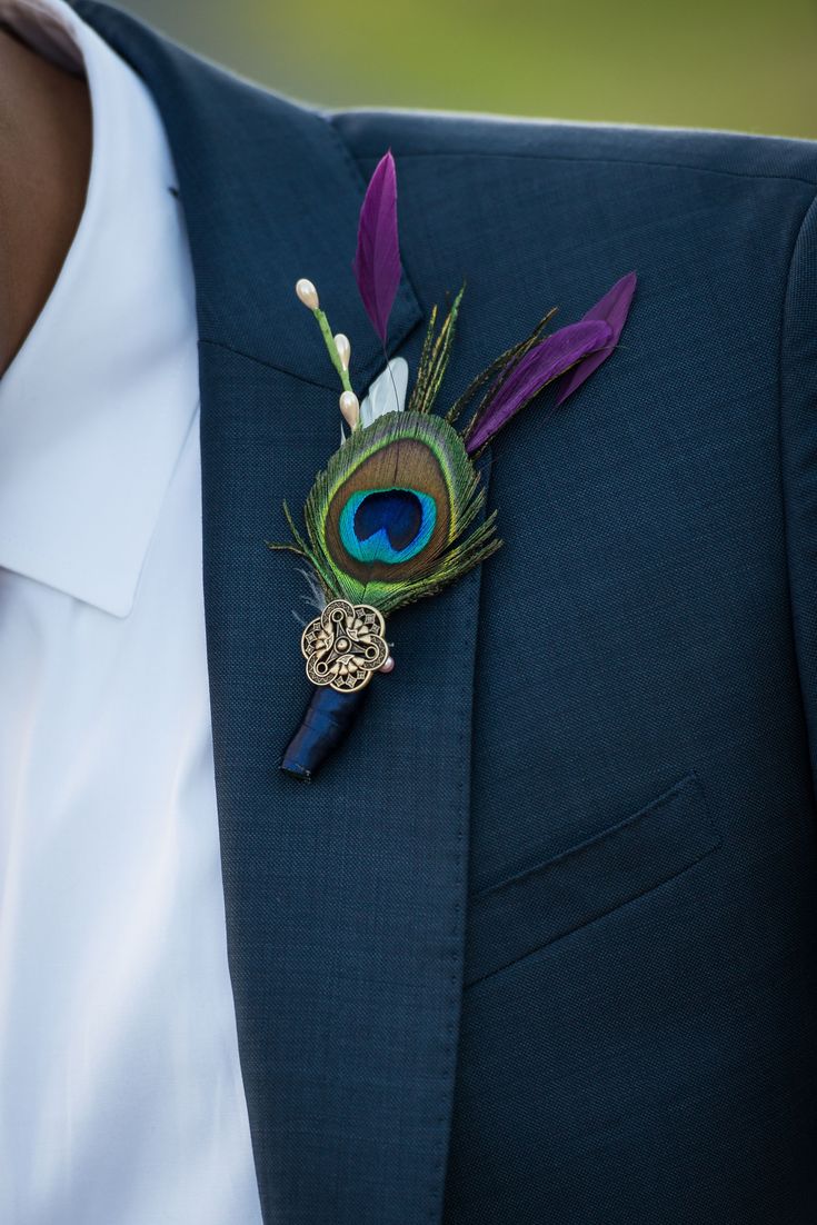 a man in a suit with a boutonniere on his lapel