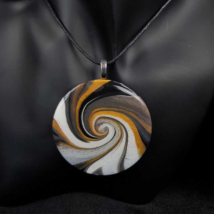 "From day-to-day, to special occasions, this intriguing piece will complement any style.  Hand crafted in polymer clay, and finished with crystal clear domed resin, this pendant is light and easy to wear.  Because of the production process, this piece is unique, and would make a great gift for a loved one, or for yourself (you deserve nice things too, you know!) This piece comes mounted on black cotton 1.5mm cord, adjustable from approx 80cm (32ins) to 40cm 16ins).  However, you can request any length of cord - just leave a message in the \"note to seller\" section at checkout.  If you would prefer the pendant mounted on a cord with adjustable lobster clasp, please add the item \"waxed cotton cord necklace\" to your basket, and please remember to state what length cord you would like in th Modern Resin Jewelry For Gifts, Modern Resin Jewelry Gift, Adjustable Resin Round Pendant Necklace, Unique Circular Necklace For Gifts, Round Large Pendant Jewelry In Resin, Unique Circle Necklace For Gifts, Resin Jewelry With Large Round Pendant, Large Round Resin Pendant Jewelry, Hand Painted White Round Pendant Necklaces