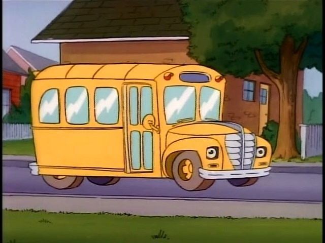 a yellow school bus parked in front of a house