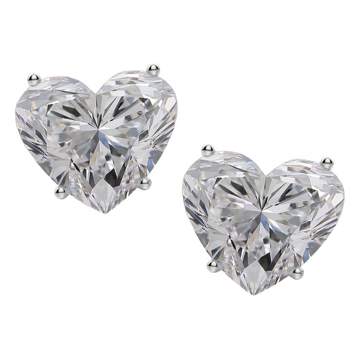 These exquisite diamond stud earrings feature two mesmerizing heart cut diamonds, with a combined weight of 4.01 carats, weighing 2.00 and 2.01 carats respectively, set in refined 18K white gold. The diamonds display exceptional color grades of E and F, radiating near-colorless brilliance that captivates the eye. With clarity grades of VVS2 and VS1, they showcase remarkable purity, ensuring a pristine and luminous appearance. The excellent polish enhances the surface to a mirror-like finish, all Heart Cut Diamond Earrings, Heart Shaped Diamond Earrings, Diamond Earrings Studs Round, White Gold Studs, White Gold Earrings Studs, Family Jewellery, Heart Shaped Diamond, Fine Jewels, Antique Earrings