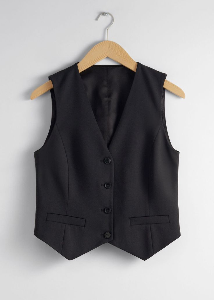 Single-breasted vest designed with duo welt pockets.• Regular fit• Fully lined• V-cut neckline • 46% RWS Wool certified by Control Union 893290Length of vest: 37cm / 14.6" (EU 36 / UK 8 / US 4) Fitted Business Vest With Pockets, Notch Lapel Vest With Button Closure For Work, Classic Notch Lapel Vest For Fall, Classic Workwear Vest With Button Closure, Fitted Vest For Workwear With Flat Front, Fitted Flat Front Vest For Work, Fitted Blazer With Vest For Work, Fitted Vest With Button Closure For Work, Business Vest With Welt Pockets