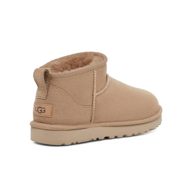 The Classic Ultra Mini updates our most iconic silhouette with a lower shaft height, adding easy on-off and enhanced versatility. Pre-treated to keep it looking better for longer, this Classic features everything you love about the original like signature UGG sheepskin and a flexible, lightweight sole. Wear with virtually anything – the styling options are endless. Ugg Classic Mini Chopd, Ugg Ultra Mini Beige, Sand Ultra Mini Uggs, Ugg Ultra Mini Ii, Ugg Ultra Mini Sand, Ugh Ultra Mini, Uggs Mini, Ugg Mini Boot, Cute Uggs