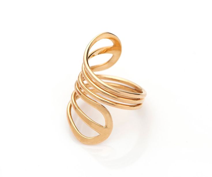 "Adjustable 14k Gold Swirl Spiral Wrap Ring,  Designer Jewelry The wide 14k gold spiral band ring is a special ring for a special woman! Spirals are everywhere in nature and in the world around us.  They symbolize spiritual development and our identity with the universe and are found in many cultures worldwide. This 14k gold Spiral ring has a wonderful modern look while maintaining a link with this age-old tradition. It is light and very comfortable to wear. A perfect gift to your loved one to s Modern Yellow Gold Spiral Ring, Modern Spiral Yellow Gold Ring, Gold Spiral Ring With A Modern Twist, Modern Gold Spiral Ring, Minimalist Gold Ring, Gold Wrap Ring, Coil Ring, Ring Wrap, How To Clean Silver