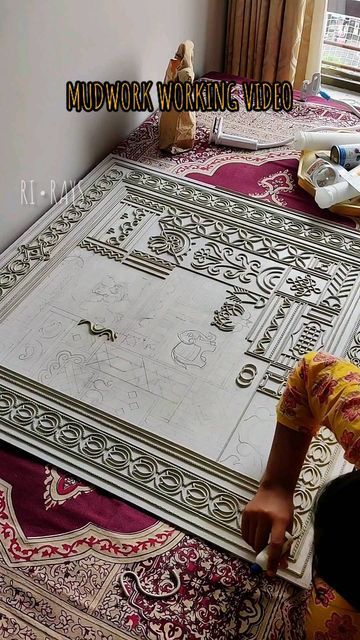 a woman laying on top of a rug in front of a window with the words mudwork working video