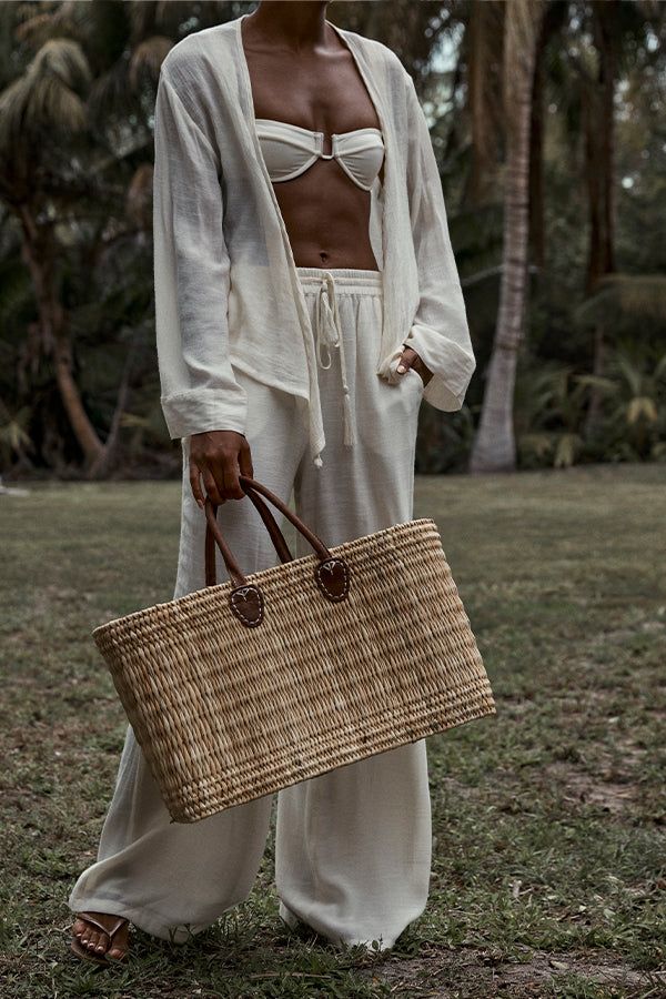 Carry it all, and be cute Imbued with the utter gorgeousness of Lake Como, Monday's structured beach bag is hand-woven of seagrass, with hand-stitched leather handles. It can be used for anything and everything: the beach, the city, the rolling hills around the lakes of Italy. It is as versatile as it is beautiful. Features:Structured straw bag Hand-woven seagrass constructionArtisan leather handlesThis bag is made from natural materials and there can be slight variations in color from time to t Straw Purse Outfit, Beach Cowboy, Lifestyle Posing, Beach Inspiration, Purse Outfit, Beautiful Features, Monday Swimwear, Summer Tote Bags, Summer Tote