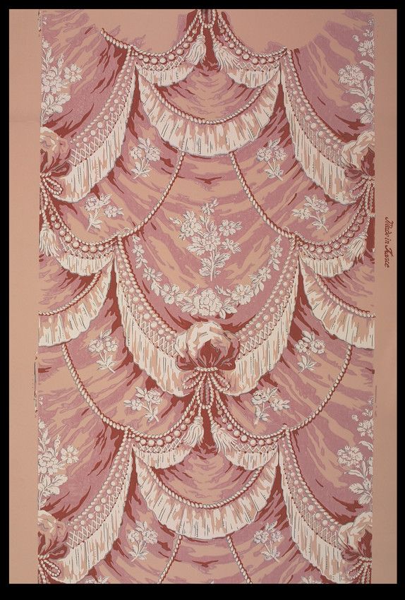 a pink and white wallpaper with an intricate design on the top half of it