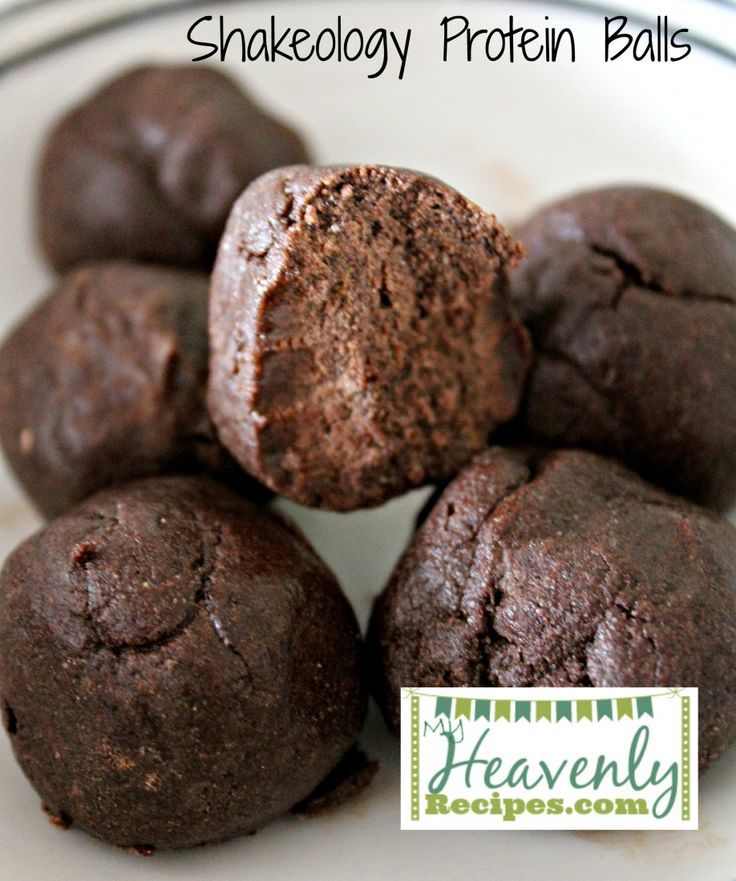 chocolate protein protein balls stacked on top of each other in a white plate with text overlay