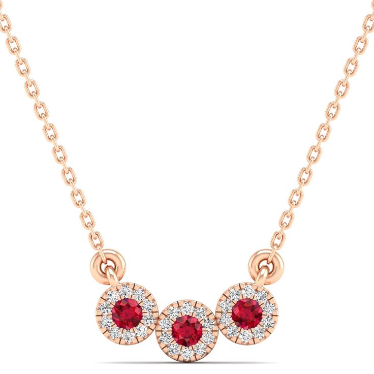 This exquisite three stone necklace features a stunning combination of diamonds and ruby, creating a timeless and elegant piece of jewelry that is perfect for any special occasion. Metal: 14K Gold Setting Type: Prong Rhodium Finish: Yes, on White Gold Gemstone Details: Gemstone: Ruby Shape: Round Average Dimensions: 2.50 MM Quantity: 03 Average Cut: Very Good Average Color: Medium to Dark Red Average Clarity: Eye Clean Natural Diamond Details: Weight: 0.14 Quantity: 30 Average Cut: Very Good Ave Fine Jewelry Diamond Three-stone Necklaces, Diamond Three-stone Necklace For Anniversary, Fine Jewelry Three Stone Diamond Necklace For Wedding, Diamond Three Stone Necklace For Anniversary, Anniversary Diamond Necklace With Three Stones, Three Stone Diamond Necklace For Wedding, Anniversary Three Stone Diamond Necklace, Diamond Three Stone Round Cut Necklace, Red Ruby Necklace With Diamond Accents