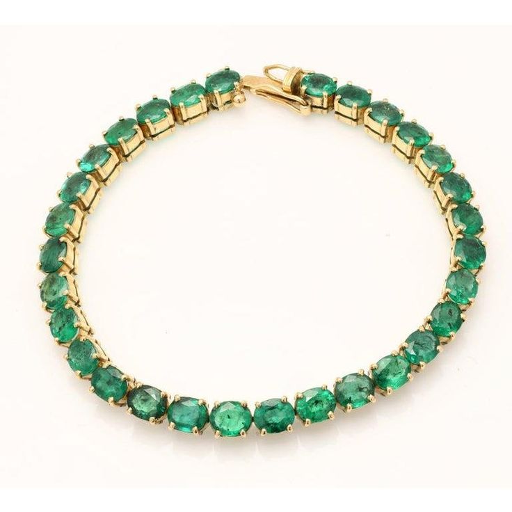 This is part of Chairish’s Fine Jewelry assortment.  Green Emerald Tennis Bracelet in 14K Gold. It has a perfect oval cut gemstone to make you stand out on any occasion or an event. A tennis bracelet is an essential piece of jewelry when it comes to your wedding day. The sleek and elegant style complements the attire beautifully, whether it's the bride wearing it herself, or as a gift to her bridesmaids to wear on the D’day. A gold gemstone bracelet is the ultimate statement piece for every stylish woman.  PRODUCT DETAILS :-  Material - 14K Solid Yellow Gold Gemstone - Emerald  Stone Weight - 24.5 ct Stone Shape - Oval  Stone Pcs - 30 Stone Size - 6 x 5 mm Gross Weight - 19.77 Grams Setting - Prong setting Length - 7.5 inch  Width - 5.4 mm Oval Gemstone Tennis Bracelet In Fine Jewelry Style, Classic Oval Gemstone Tennis Bracelet, Oval Gemstone Tennis Bracelet Gift, Formal Oval Gemstone Tennis Bracelet, Oval Tennis Bracelet For Formal Occasions, Classic Green Oval Tennis Bracelet, Luxury Oval Tennis Bracelet As Gift, Green Oval Tennis Bracelet As Gift, Green Oval Tennis Bracelet For Gift