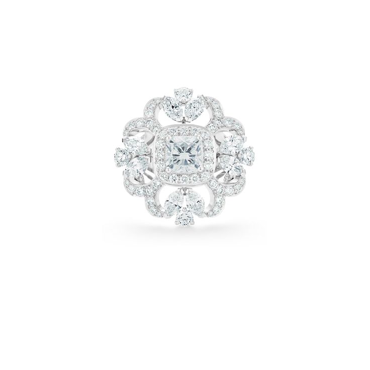 There is a kaleidoscopic feel to the Ellesmere Treasure set and this exceptional ring, comprising 101 white diamonds, unfurls into a frozen flower. Surrounding a 1.20 carat cushion-cut white diamond is a row of round brilliant pavé. From this, arcs of pavé emanate, tipped with marquise-cut diamonds. Round brilliant pavé extends down the upper shank to further enhance the scintillation of this very special piece. Total weight, 3.75 carats. Luxury White Diamond Ring With Center Stone, Luxury White Lab Grown Diamond Ring, White Luxury Lab-grown Diamond Ring, White Asscher Cut Lab Grown Diamond Ring, White Asscher Cut Lab-grown Diamond Ring, Luxury White Lab-grown Diamond Ring, Timeless White Diamond Ring, Dazzling Asscher Cut Diamond White Diamond Ring, Dazzling Asscher Cut Diamond White Ring