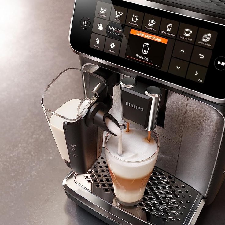 an espresso machine with milk being poured into it