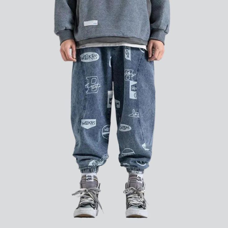 Step out in style with the 2023 Spring-Summer Collection's medium-waist denim joggers! Crafted with premium denim. these joggers feature a street-style distressed pattern and drawstrings closure. making them the perfect blend of contemporary fashion and nostalgic grunge.Why They're Your Next Summer Staple: Grunge Galore: Inspired by the iconic '90s grunge movement. these joggers exude an effortlessly cool attitude. Distinctive Paint Pattern: Expertly crafted with a unique street-style paint patt Casual Graphic Print Sweatpants For Streetwear, Casual Relaxed Fit Graphic Joggers, Casual Relaxed Fit Graphic Sweatpants, Casual Graphic Print Sweatpants With Relaxed Fit, Casual Graphic Print Relaxed Fit Joggers, Casual Sweatpants With Graphic Print For Streetwear, Casual Sweatpants With Graphic Print And Relaxed Fit, Casual Relaxed Fit Sweatpants With Graphic Print, Denim Blue Graphic Bottoms For Streetwear