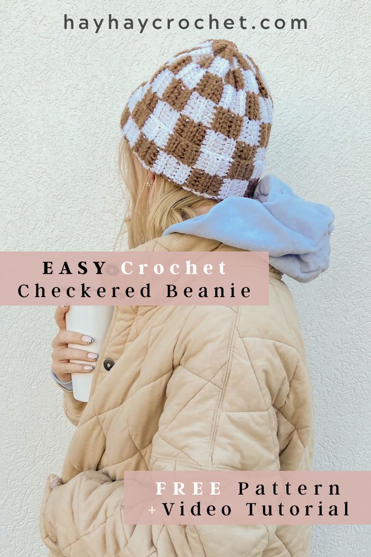 a girl wearing a brown and white crochet beanie holding a coffee cup