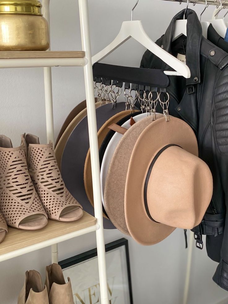 hats and shoes are hanging on a rack